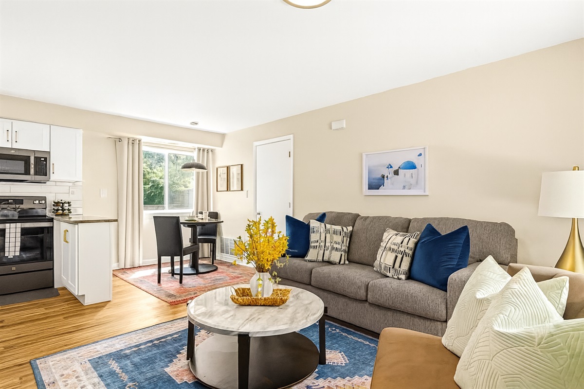 Relax in our inviting living room furnished with cozy seating and a smart TV for your entertainment.