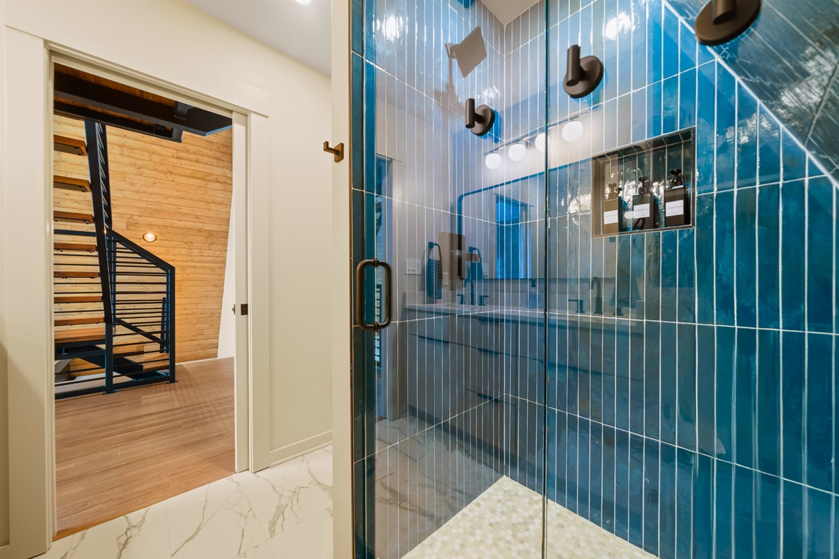 Bold tile and the glass shower make this bathroom feel extra stylish, giving it a fun boutique-hotel vibe while still being super functional.