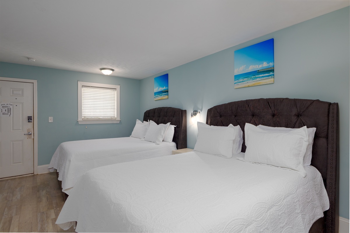 Soft, white bedding creates a serene atmosphere