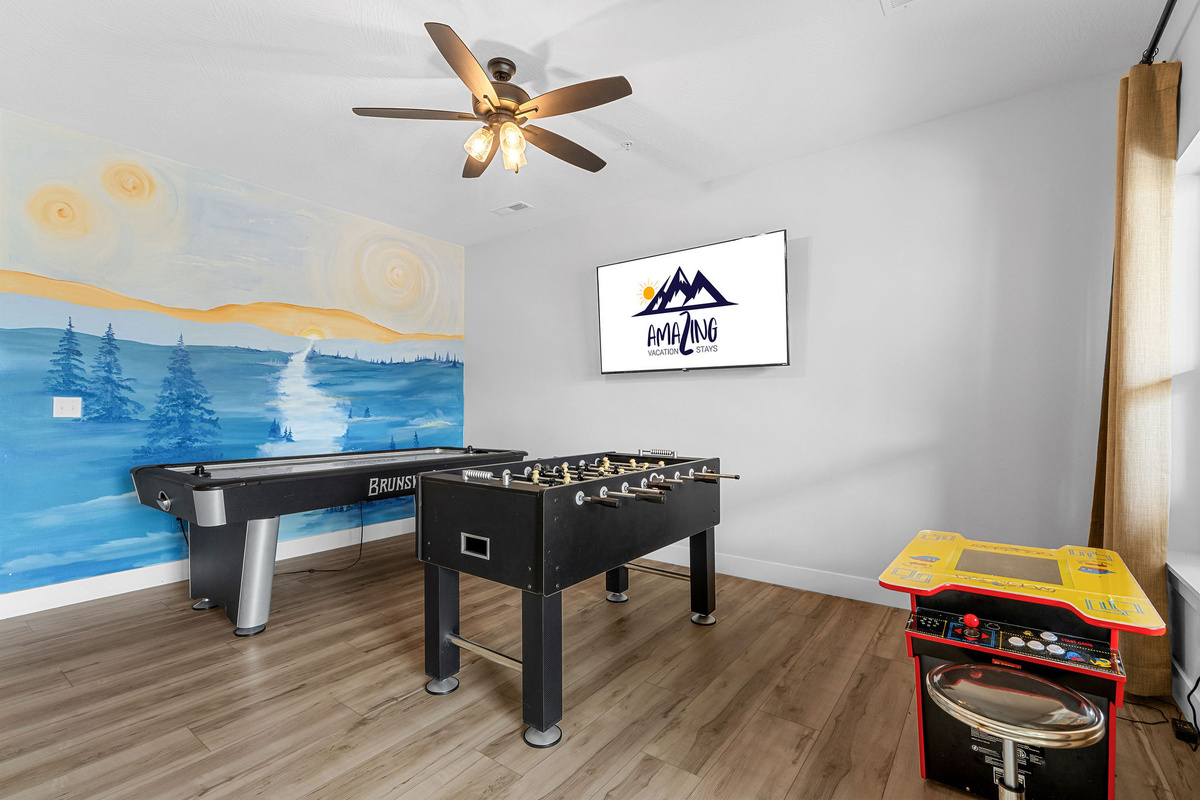 Downstairs Game Room with Air Hockey, Foseball and a pacman arcade. 