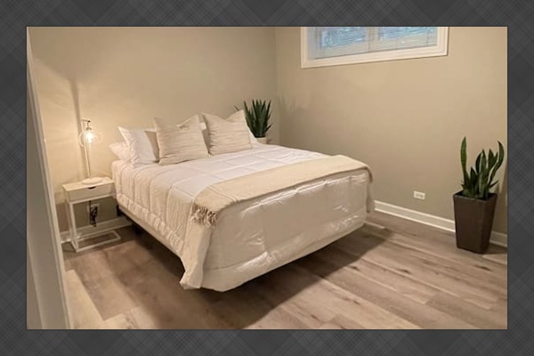 Bright comfortable bedroom designed for restful sleep after busy Chicago days