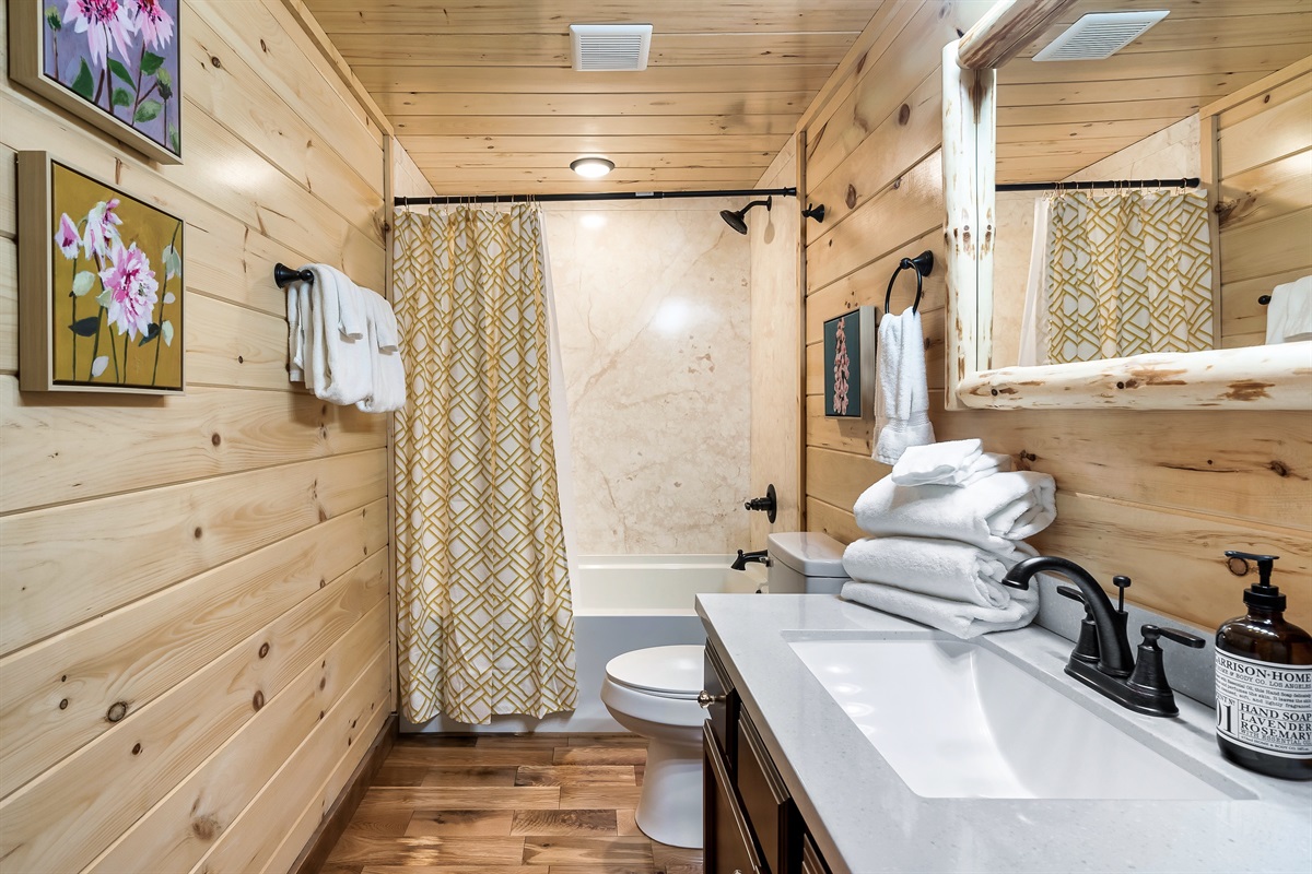 The Gold bathroom has a shower/tub combo