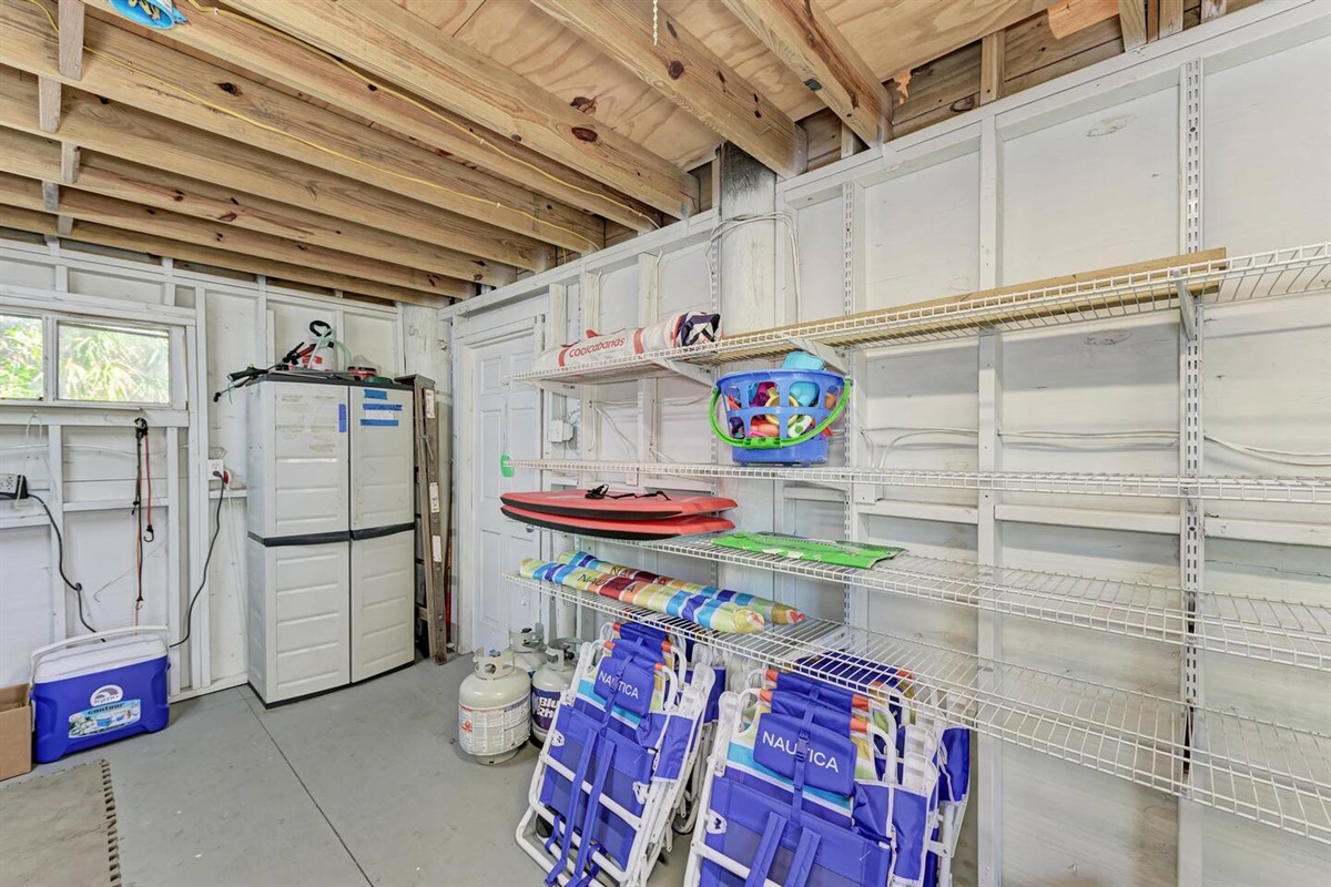 Beach gear in the shed: umbrellas, toys, skim boards, and 8 chairs! Not pictured: extra fridge in shed