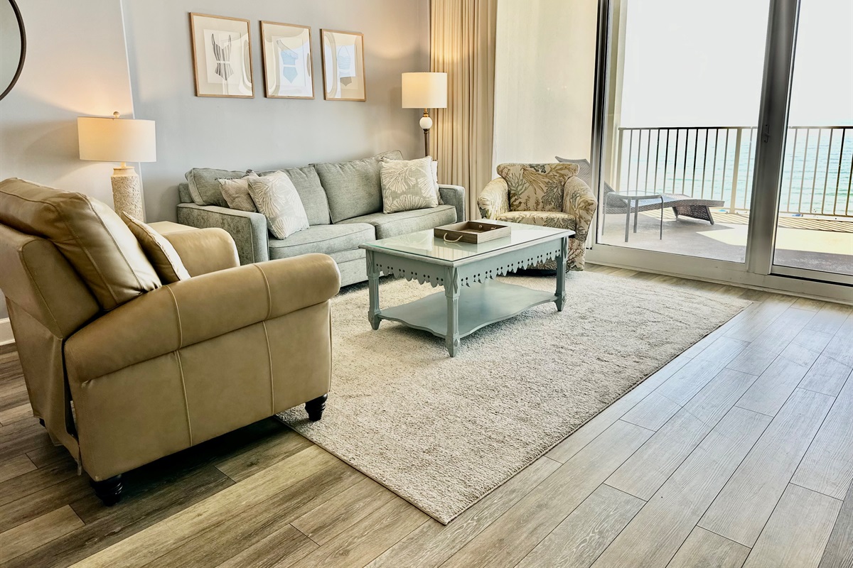 Sofa sleeper, leather recliner and comfy swivel chair...and that view!