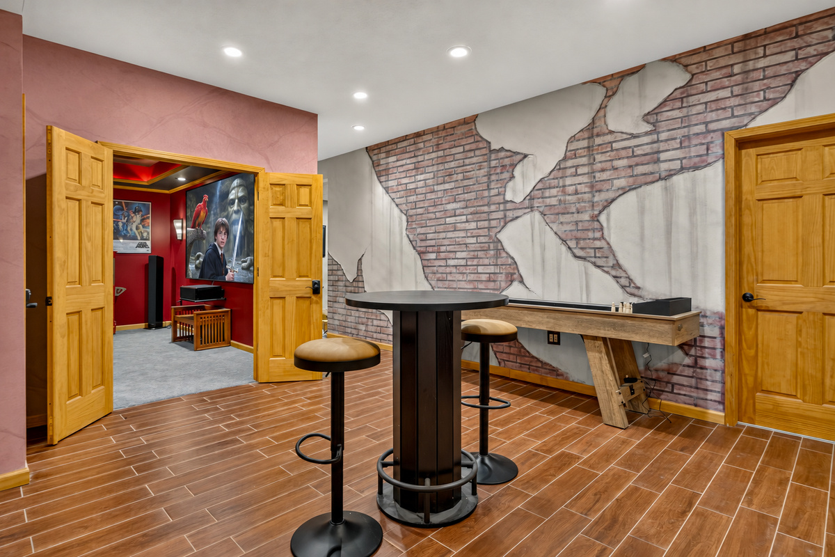 Bar area with high-top tables and stools