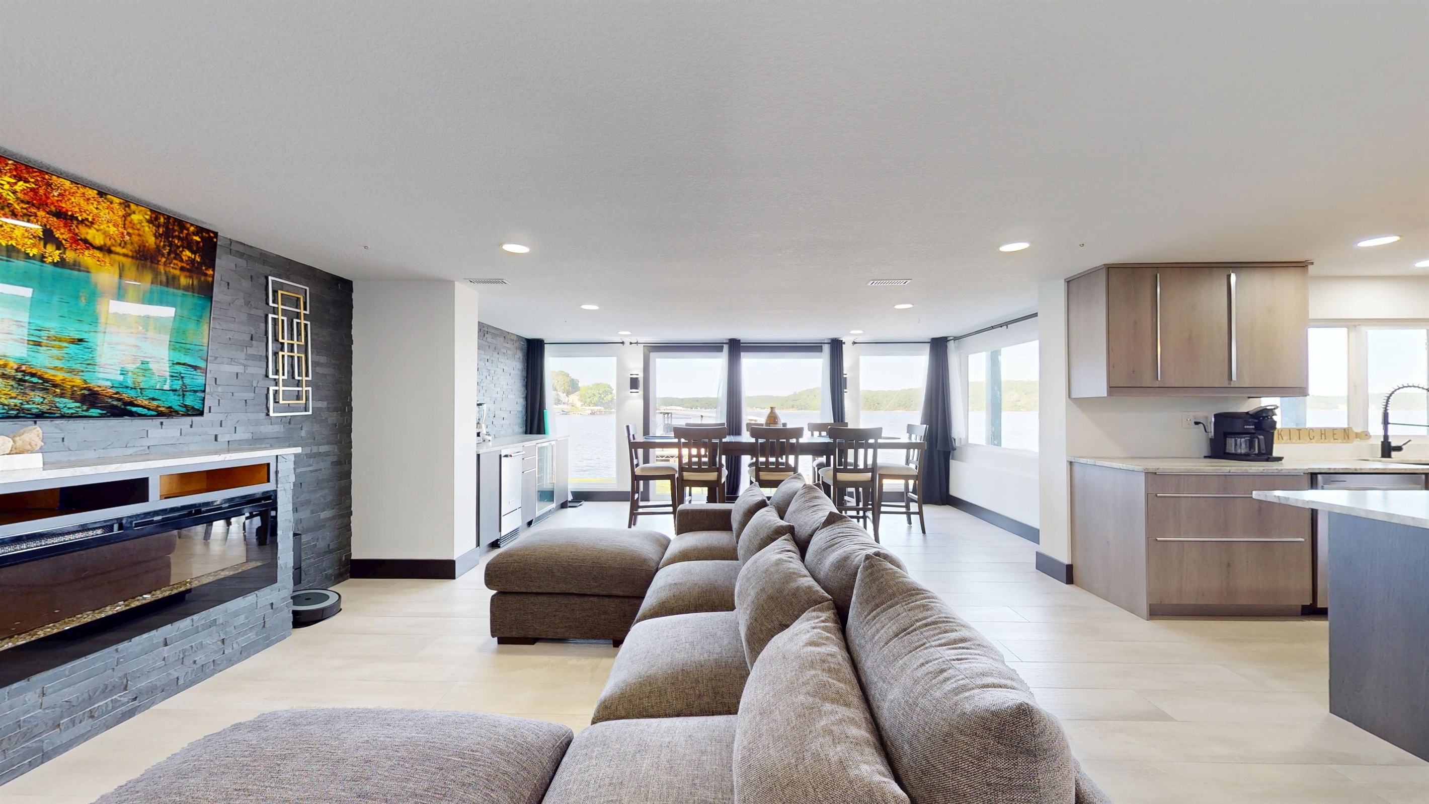 Enjoy The Grand View Lakehouse in all four seasons with an electric fireplace and big open spaces to view the lake as well as that important game on this 85" SmartTV.