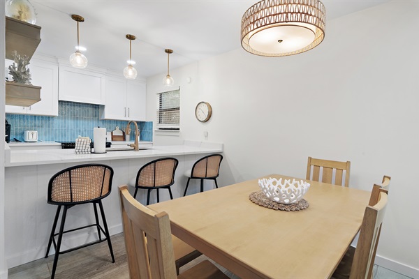 Dining for 6 at the table. 3 barstools at the counter. 