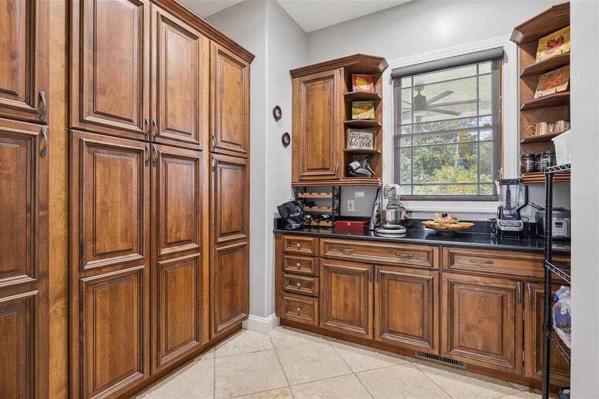 Large Pantry with lots of storage in back of the Kitchen