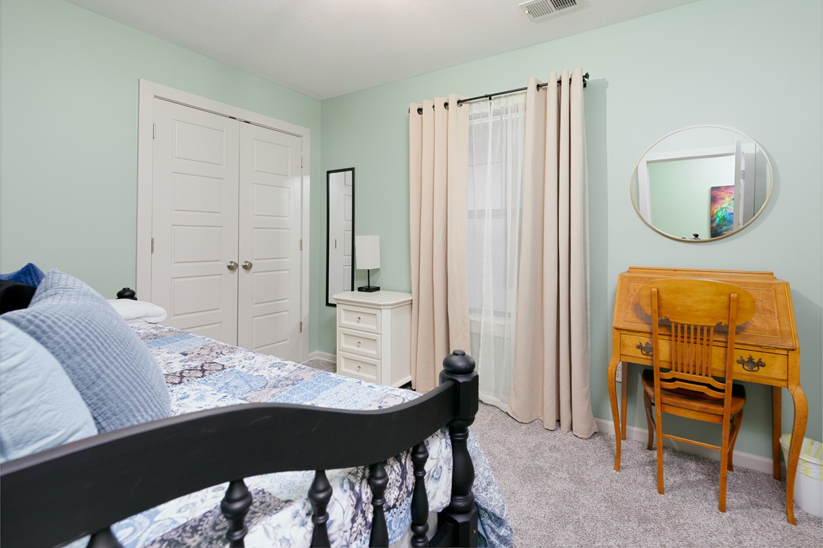 Third bedroom featuring a twin daybed with pull-out trundle, offering flexible sleeping arrangements in a comfortable, space-efficient layout.