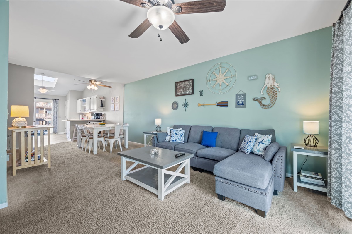 Relax in a bright beach inspired living space with plenty of room to spread out, unwind, and plan the next seaside adventure