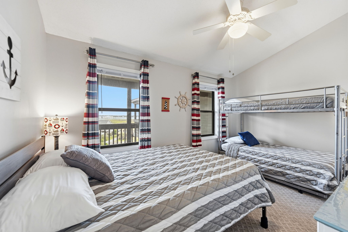 Sleep options for the whole crew with twin bunks, a trundle, and a cozy queen bed.