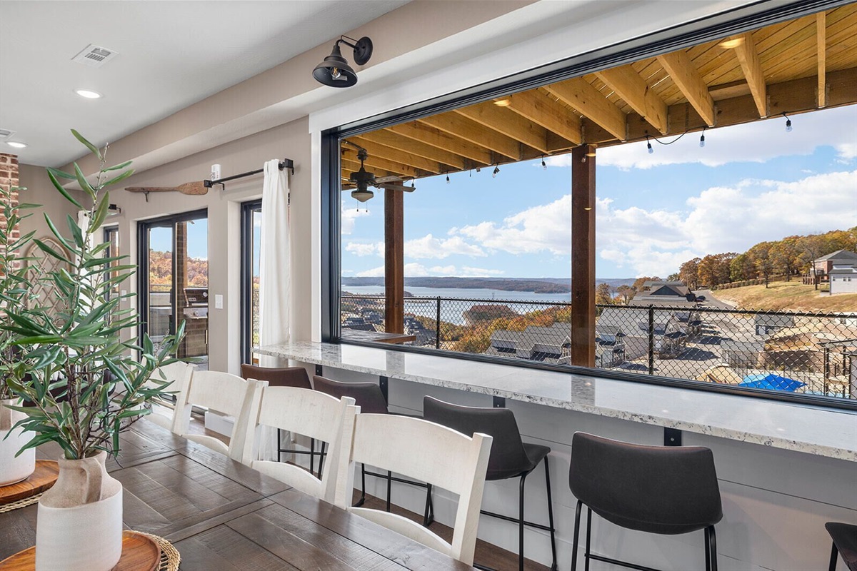 Main Level large window with bar overlooking amazing lakeview
