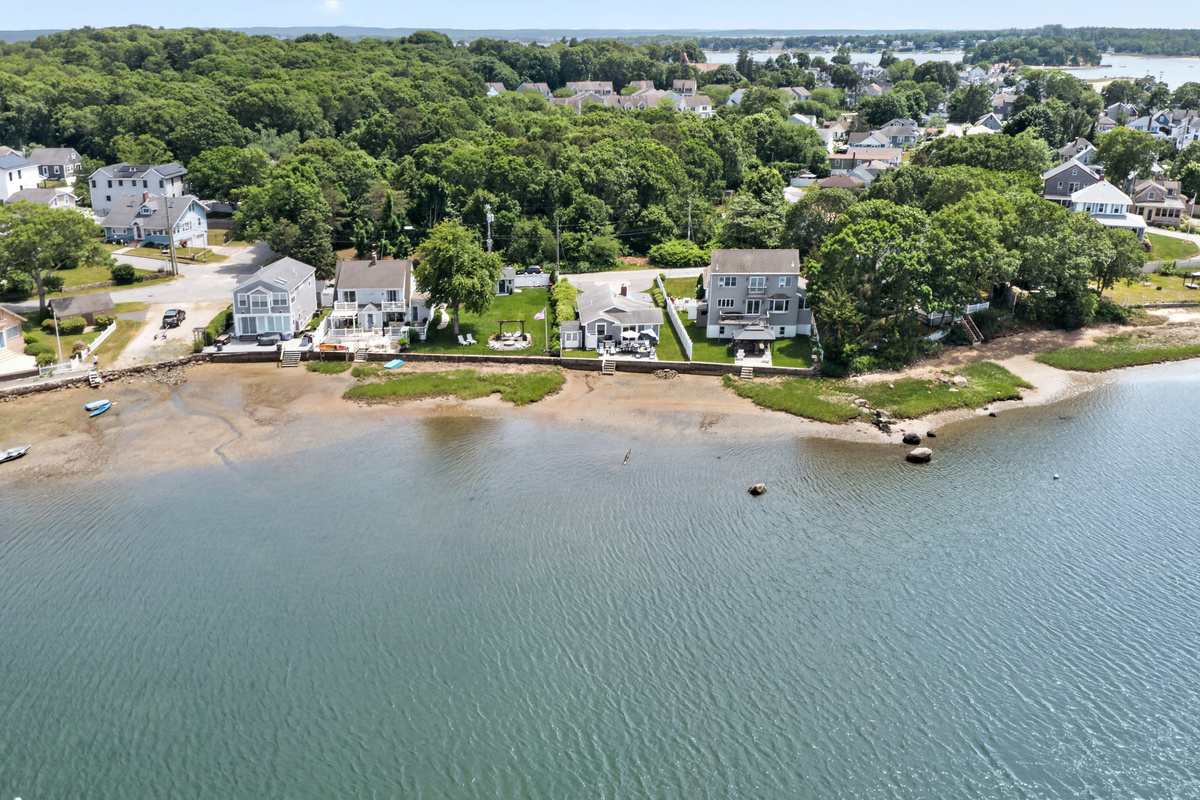 Aerial view of the scenic bay and the surrounding waterfront community.