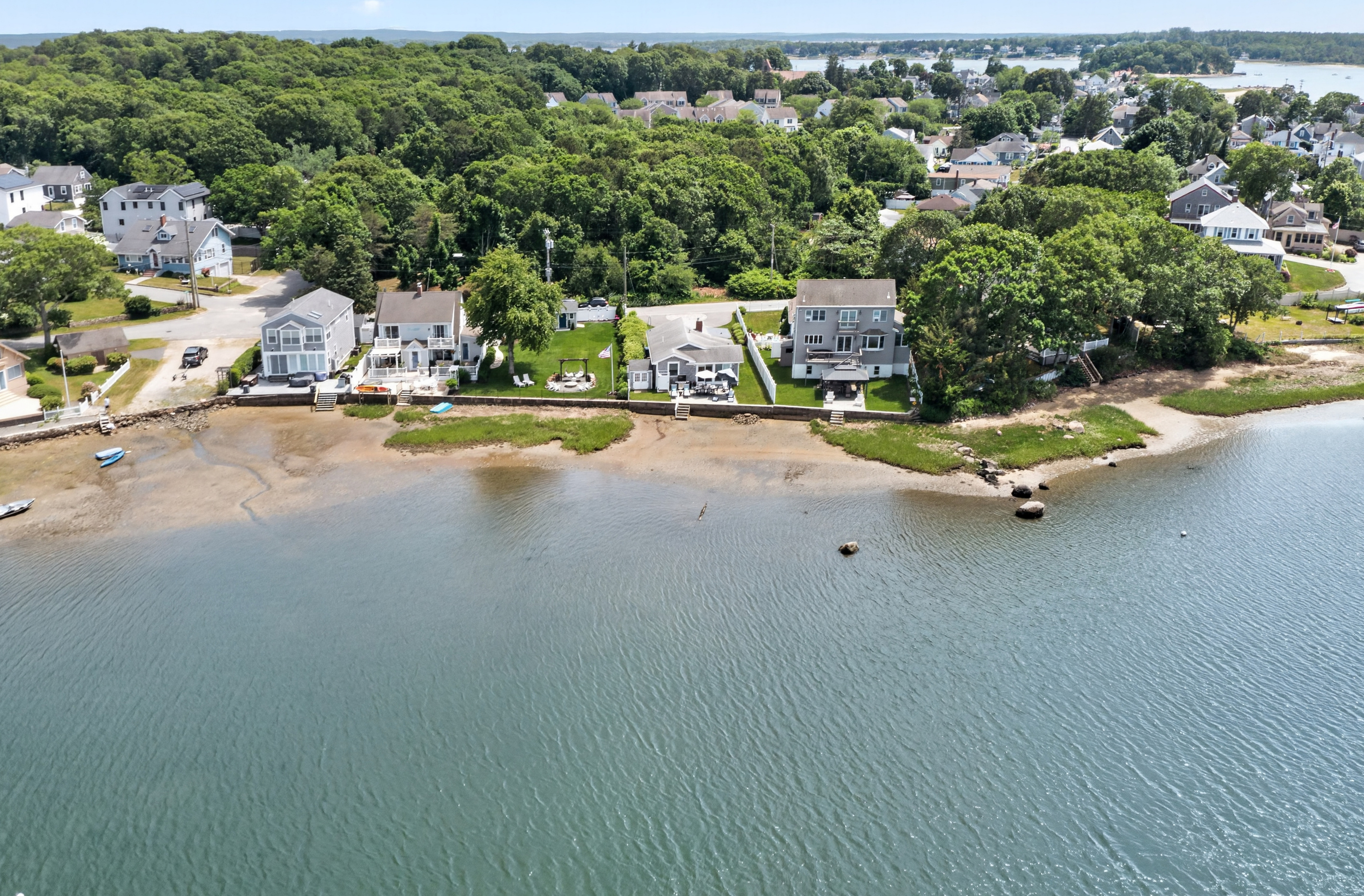 Aerial view of the scenic bay and the surrounding waterfront community.
