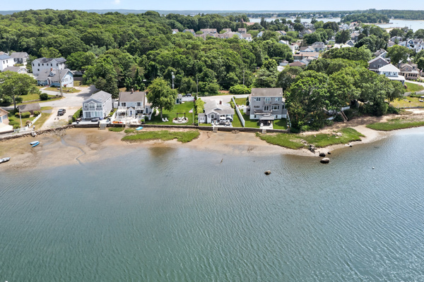 Aerial view of the scenic bay and the surrounding waterfront community.