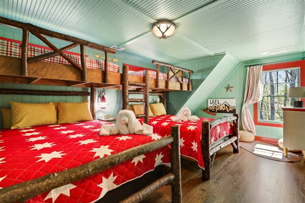 “Tree House” Custom built bunk room with two twins over two queen beds.