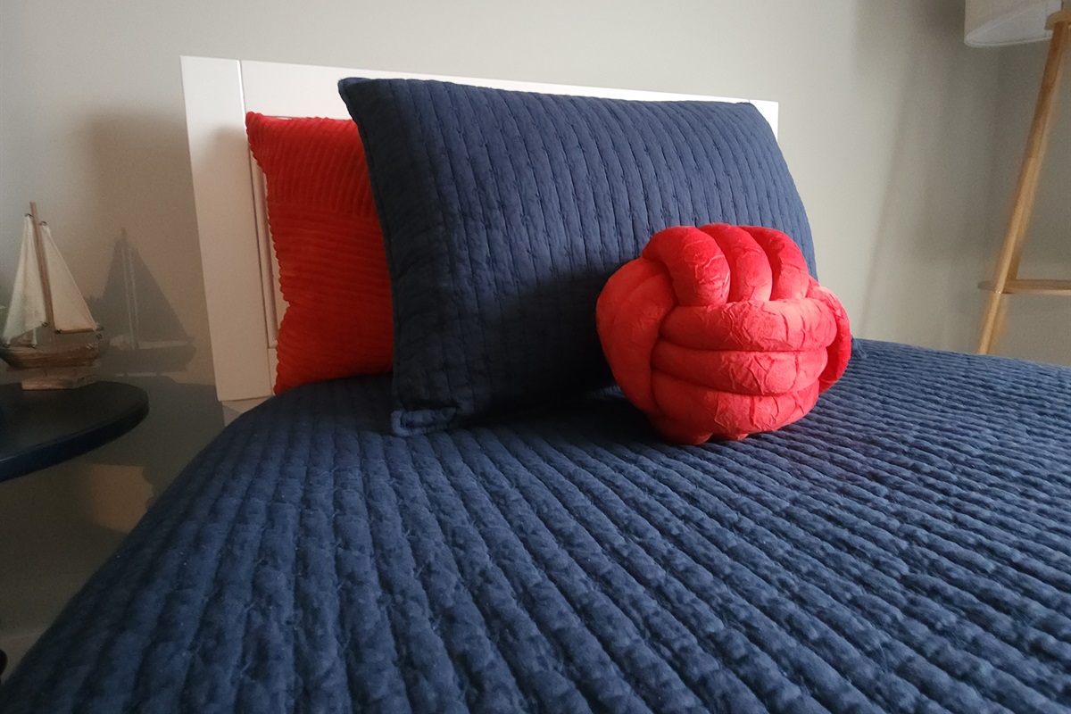 One of two twin beds in Kids Game Loft