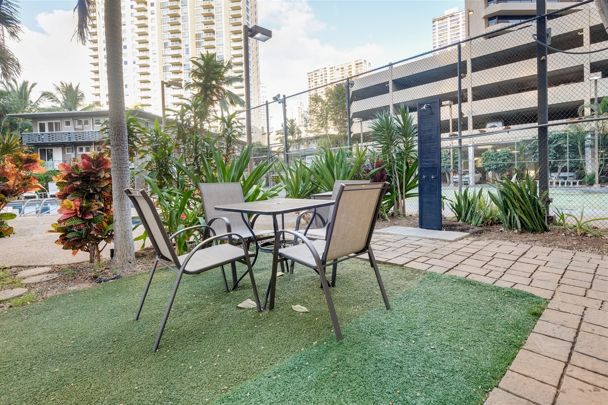 Enjoy outdoor dining surrounded by tropical palms and island breezes. This relaxing seating area near the pool is perfect for morning coffee, afternoon lunches, or sunset conversations in paradise