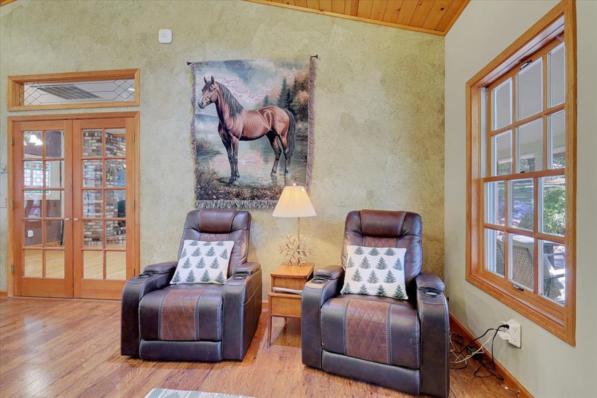 Two leather recliners with a side table, reading lamp, and a simple spot to sit back.