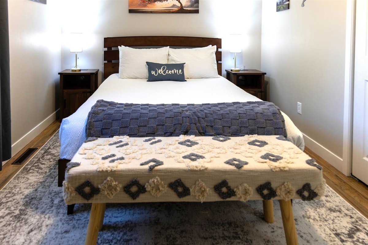 Bedroom 2- Queen Bed. Nightstands have plug- ins for charging.