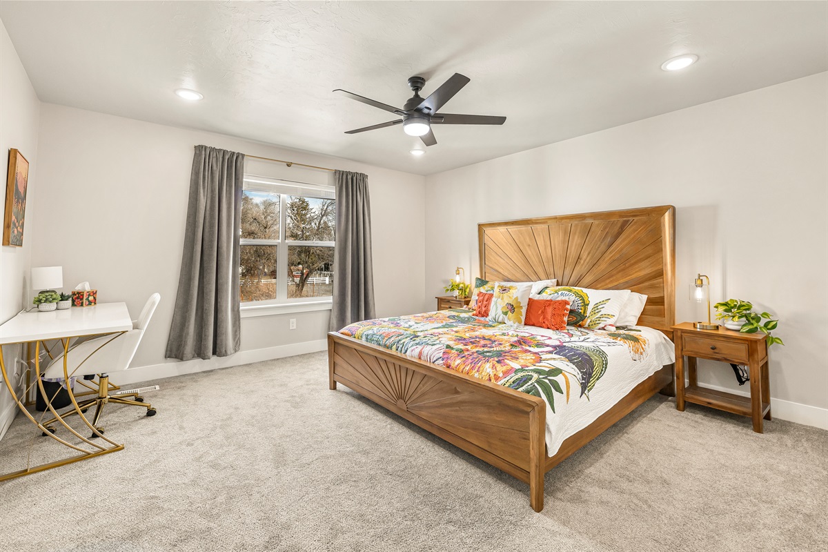 Master bedroom with a workspace area.