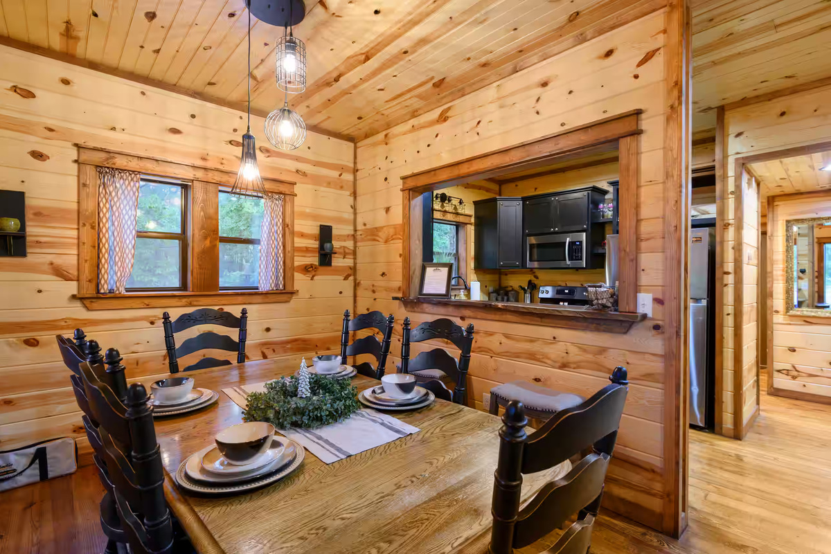 Dining Room: Gather around the rustic table for meals and memories in a wood-accented haven!