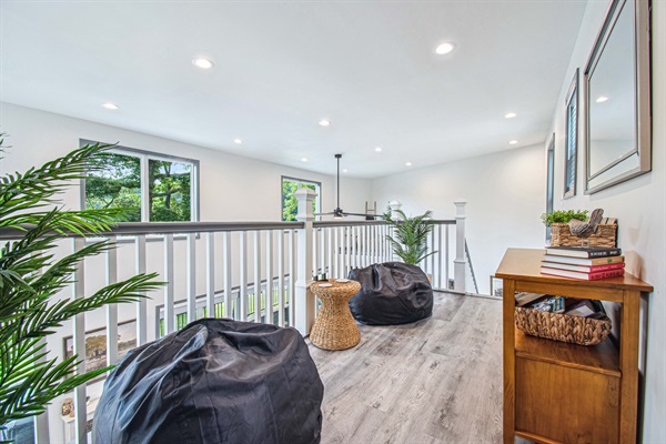 Discover the joy of reading in our comfy upstairs nook, where beanbags invite you to unwind and escape into a good book.