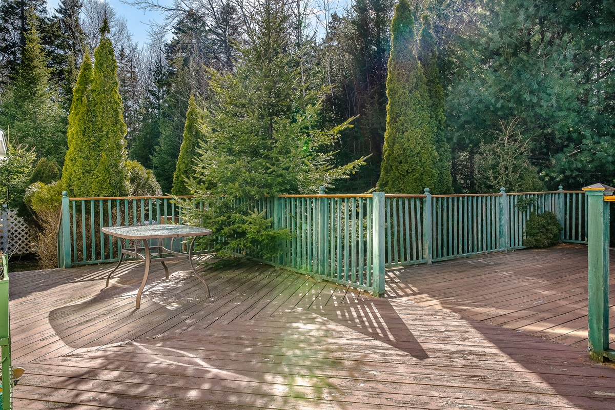 The expansive back deck is your private outdoor sanctuary. Bordered by mature evergreens, it’s the ideal spot for morning coffee, grilling local fare, or relaxing in the sun. Enjoy the quiet side of MDI from this peaceful Southwest Harbor overlook.