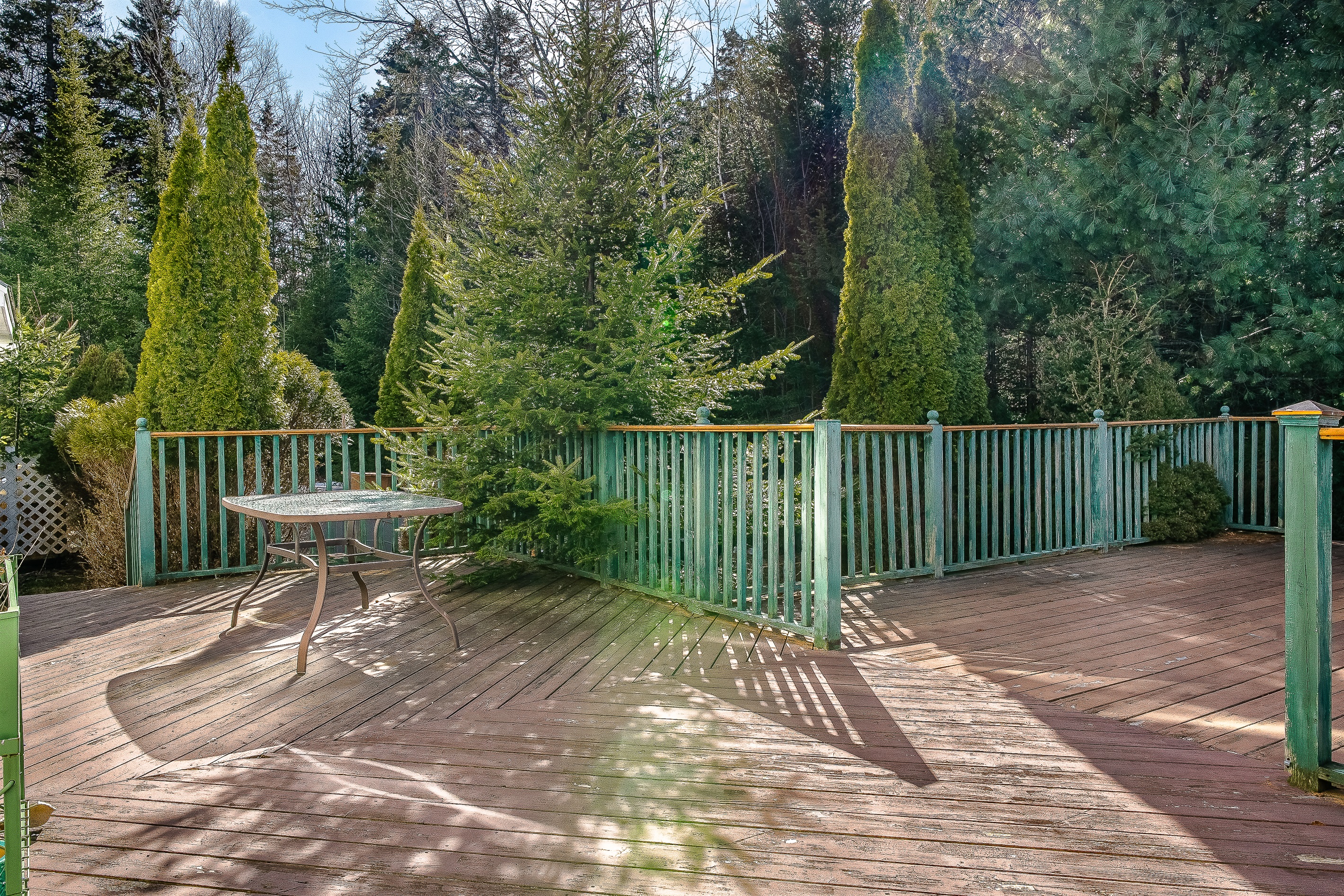The expansive back deck is your private outdoor sanctuary. Bordered by mature evergreens, it’s the ideal spot for morning coffee, grilling local fare, or relaxing in the sun. Enjoy the quiet side of MDI from this peaceful Southwest Harbor overlook.