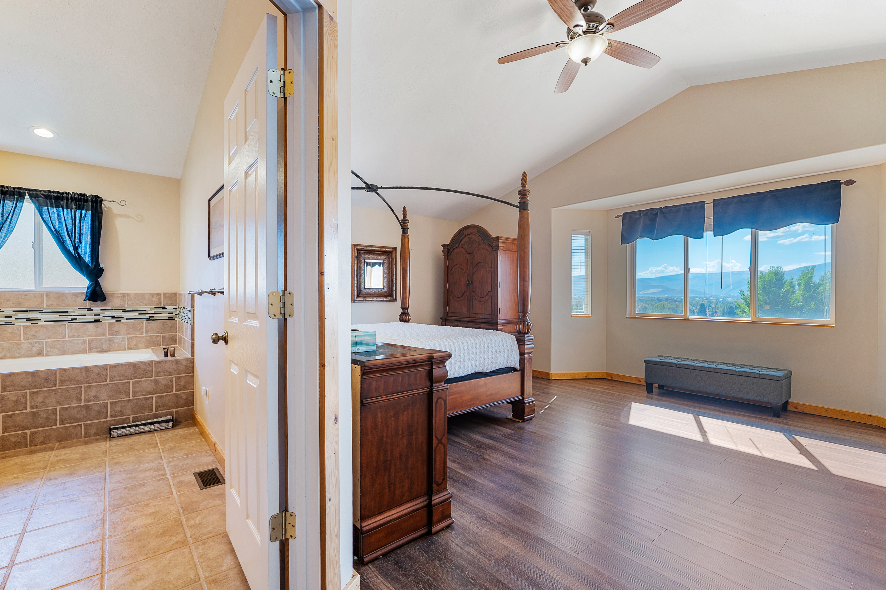 Connected master suite provides a luxurious retreat with stunning views