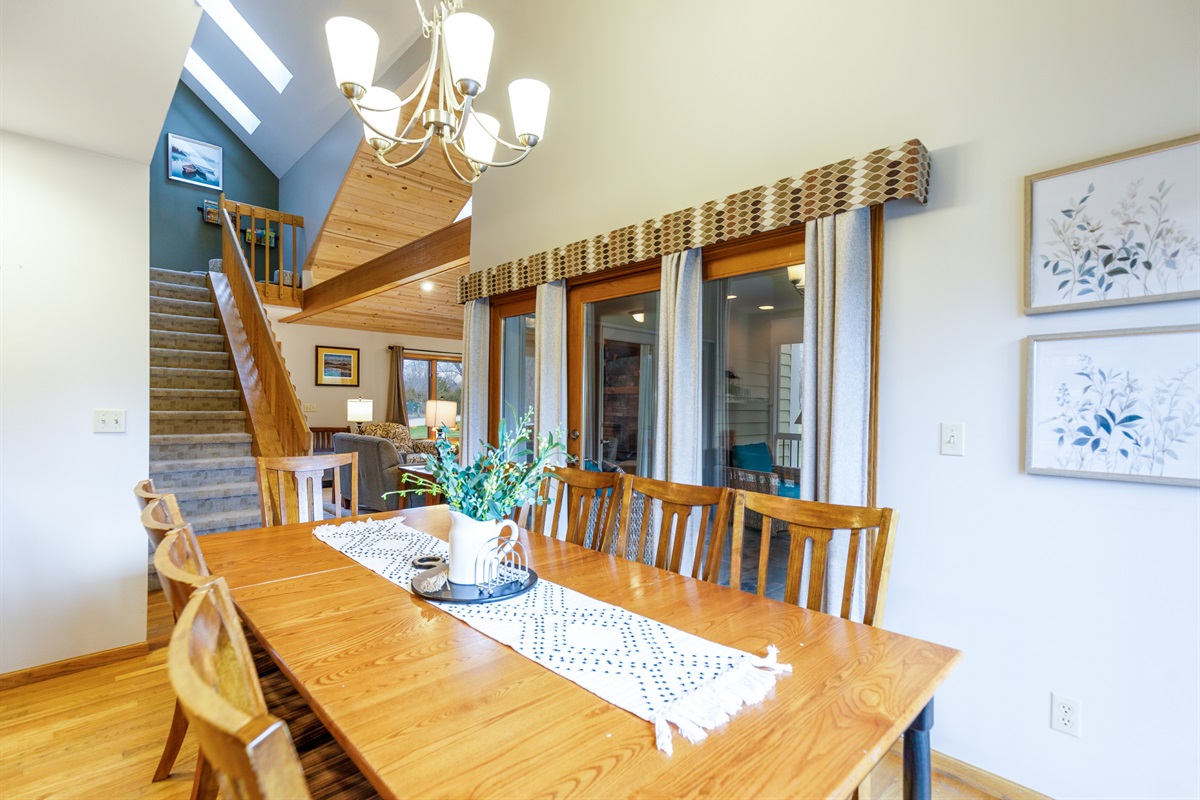 The dining table seats 8 with additional seating available at the breakfast bar