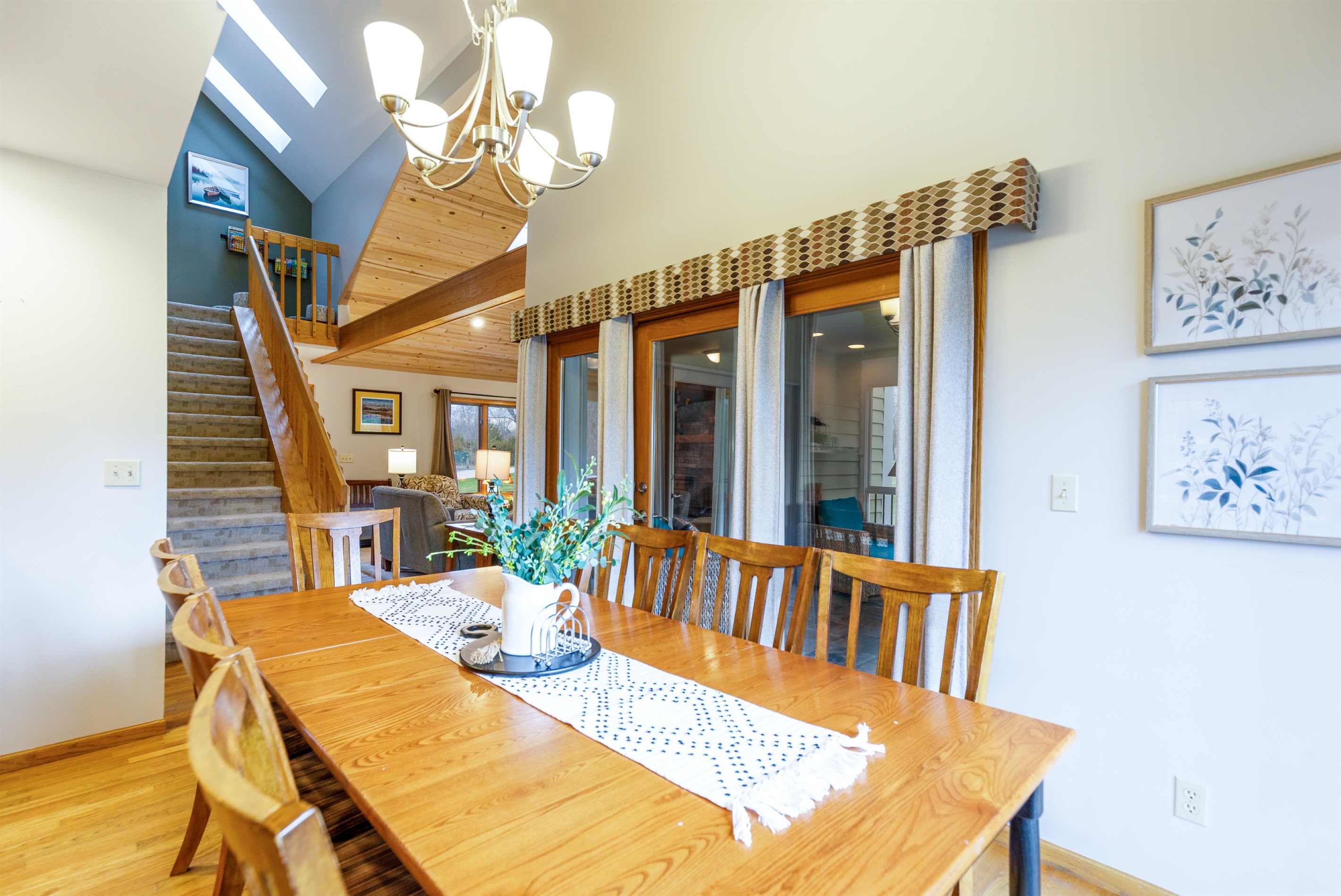 The dining table seats 8 with additional seating available at the breakfast bar