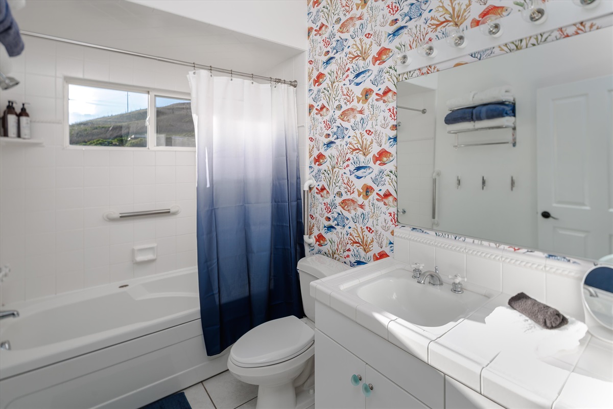 Clean, bright, and fully stocked — a comfy bathroom with everything your family needs.