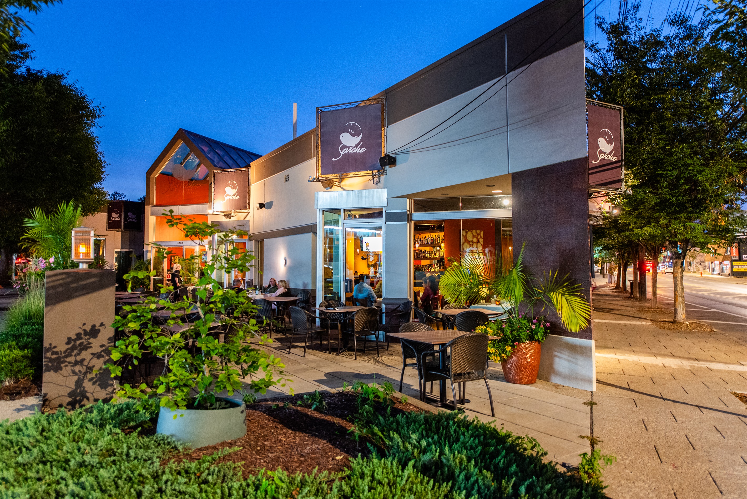 Cozy outdoor dining at Seviche, led by a James Beard Award Nominee chef, on Bardstown Road near the home. Lush plants, warm lighting—perfect after the KY Bourbon Trail!