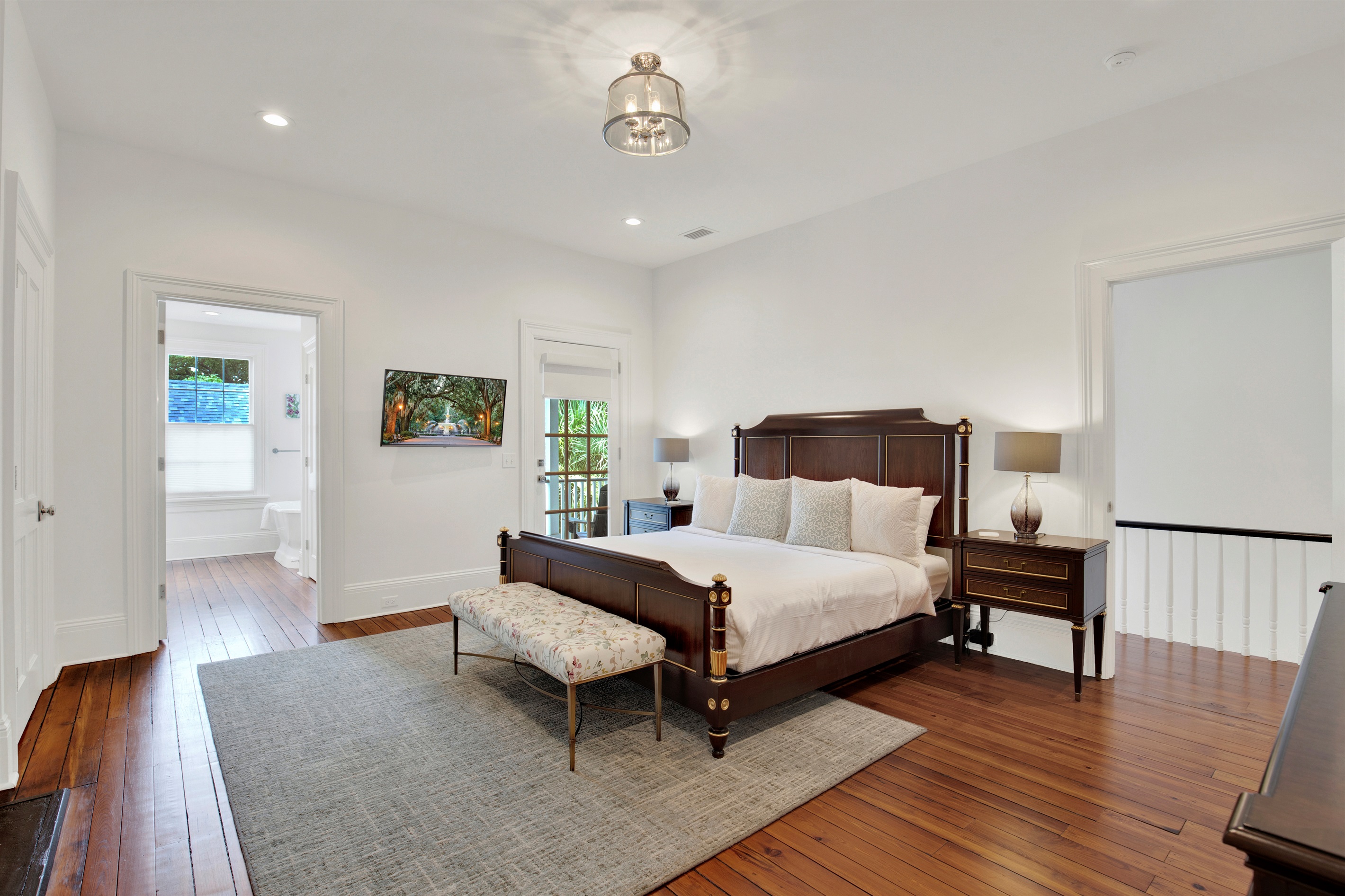 Primary suite with balcony access + luxurious ensuite bath.