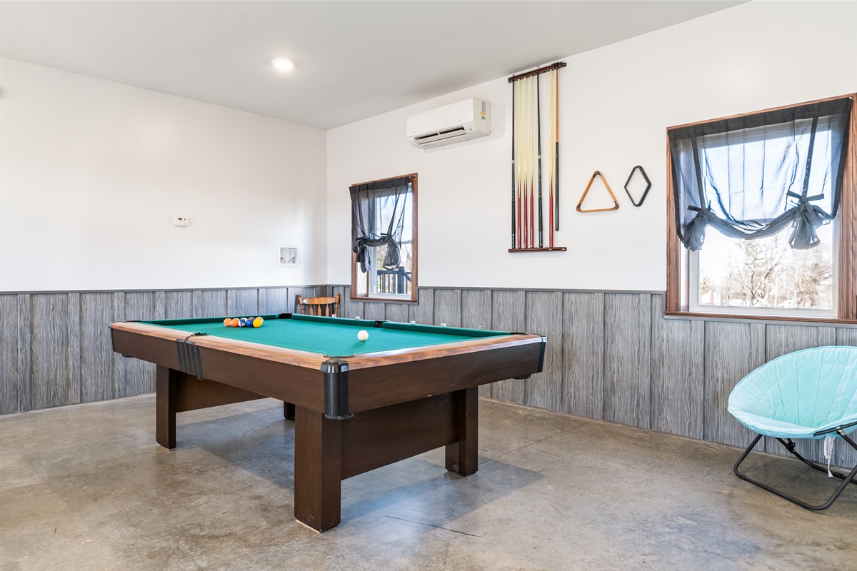 Challenge friends to a game of pool in this spacious rec room—perfect for family fun and friendly competition!