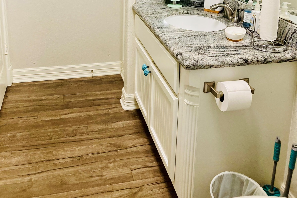 Guest bathroom main level behind kitchen