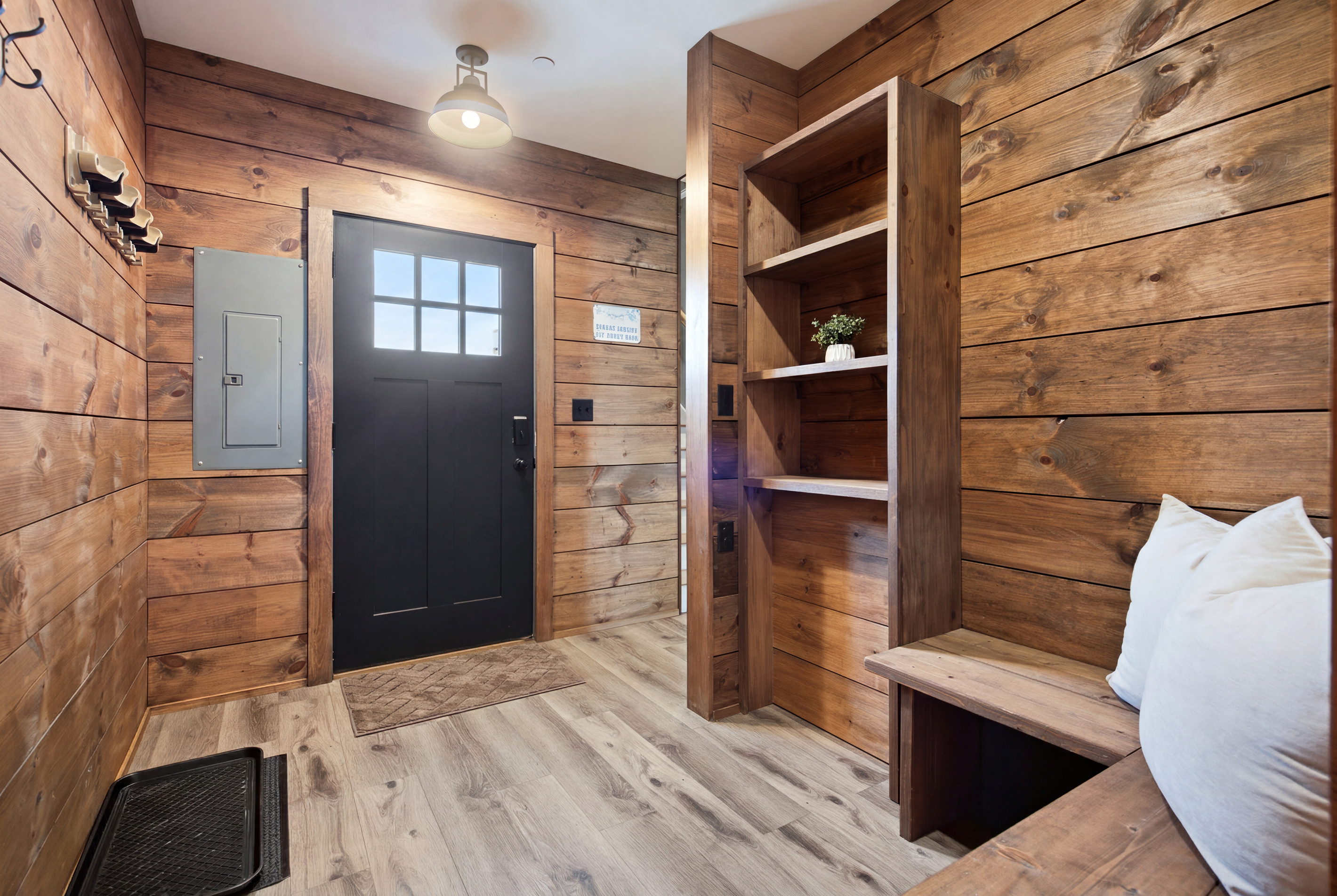 Warm wood finishes create a cozy and welcoming entrance from the moment you arrive.