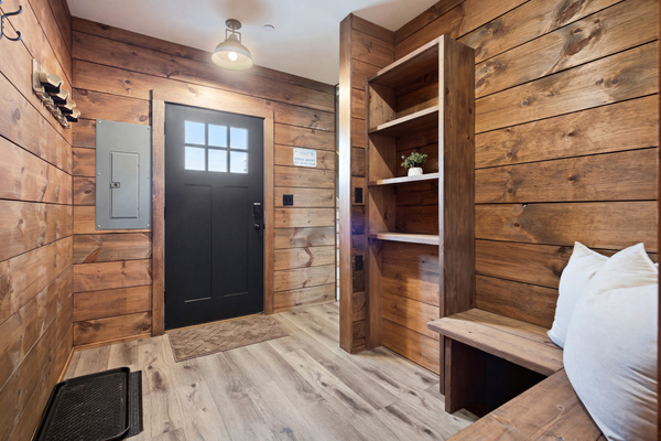 Warm wood finishes create a cozy and welcoming entrance from the moment you arrive.