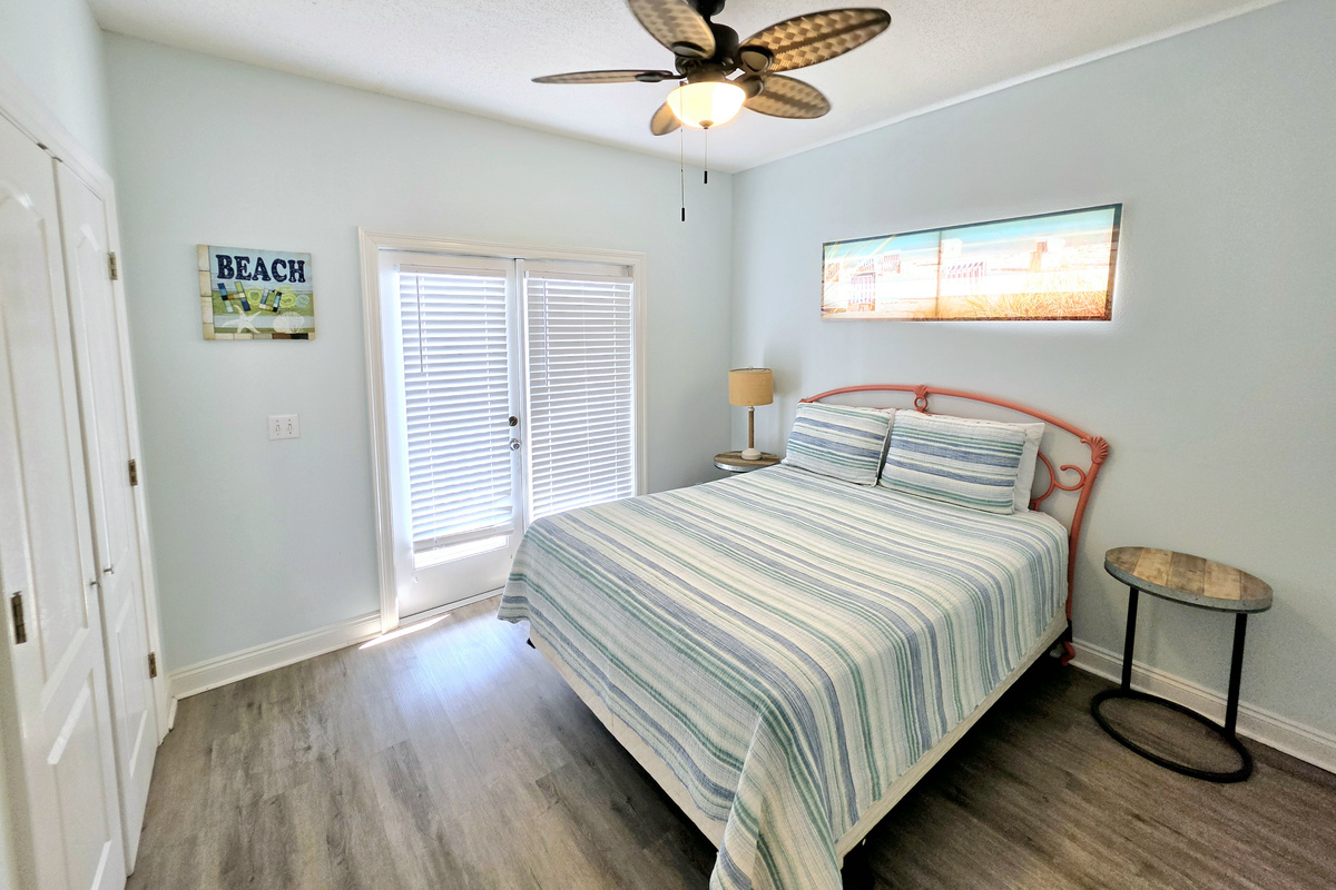Bedroom with ceiling fan and French doors