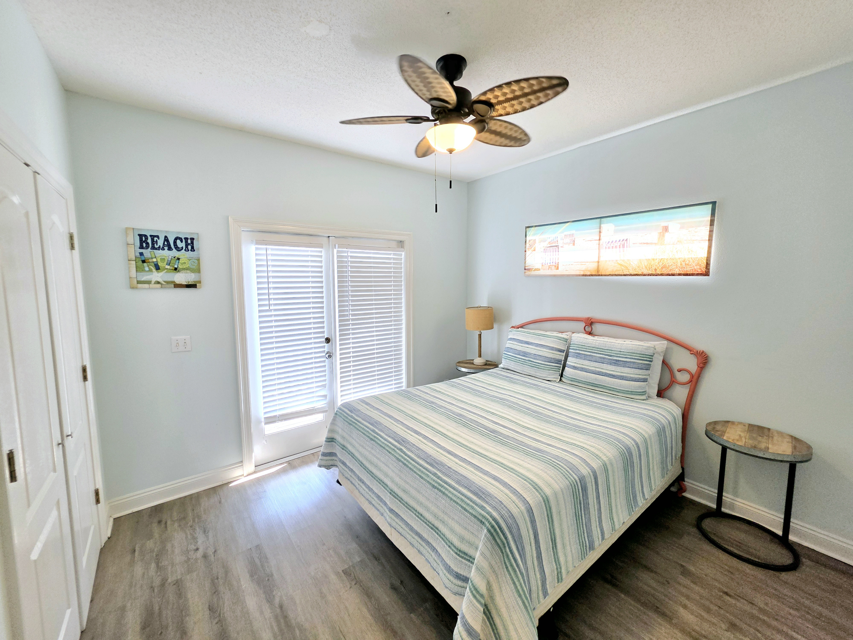 Bedroom with ceiling fan and French doors