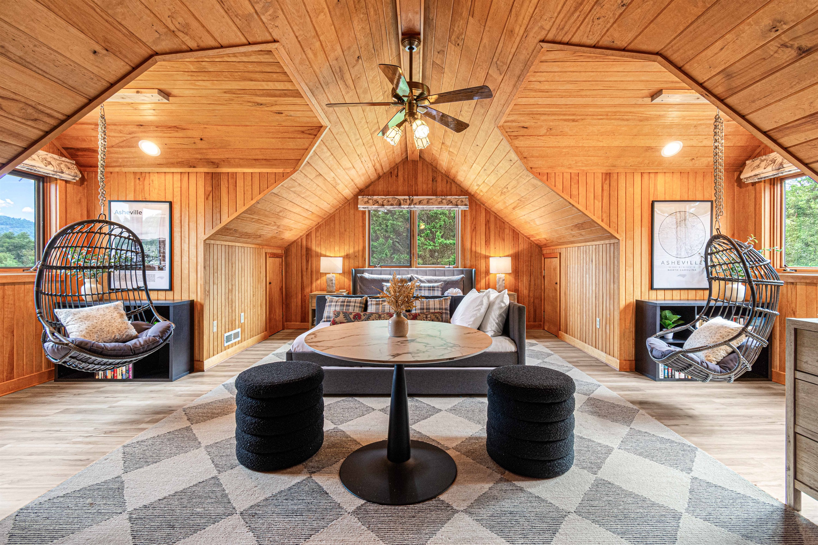 The Tanbark Ridge Primary Suite feels like a private retreat in the treetops—complete with hanging chairs, vaulted wood ceilings, and cozy lounge space to relax or reconnect.🌿🛋️✨