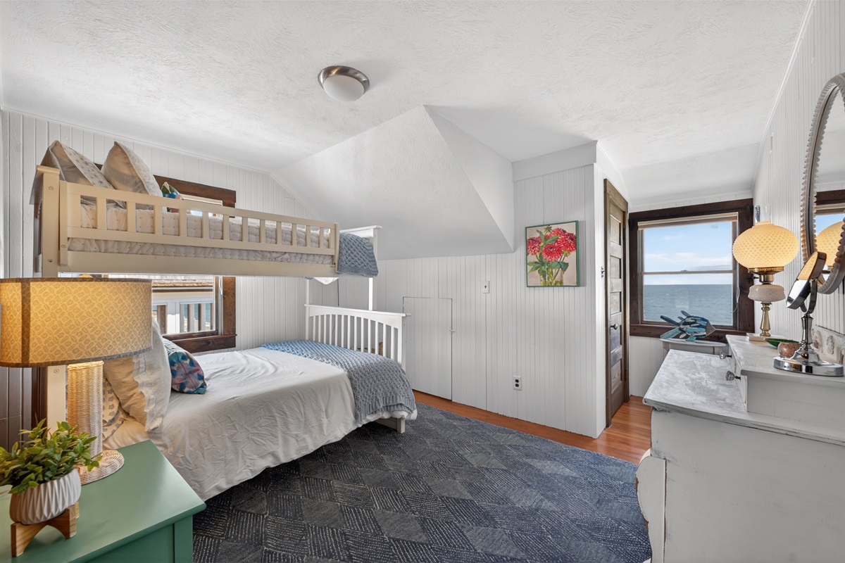 Fun and airy oceanfront bunk room with a twin-over-full setup, ideal for little adventurers or small groups.