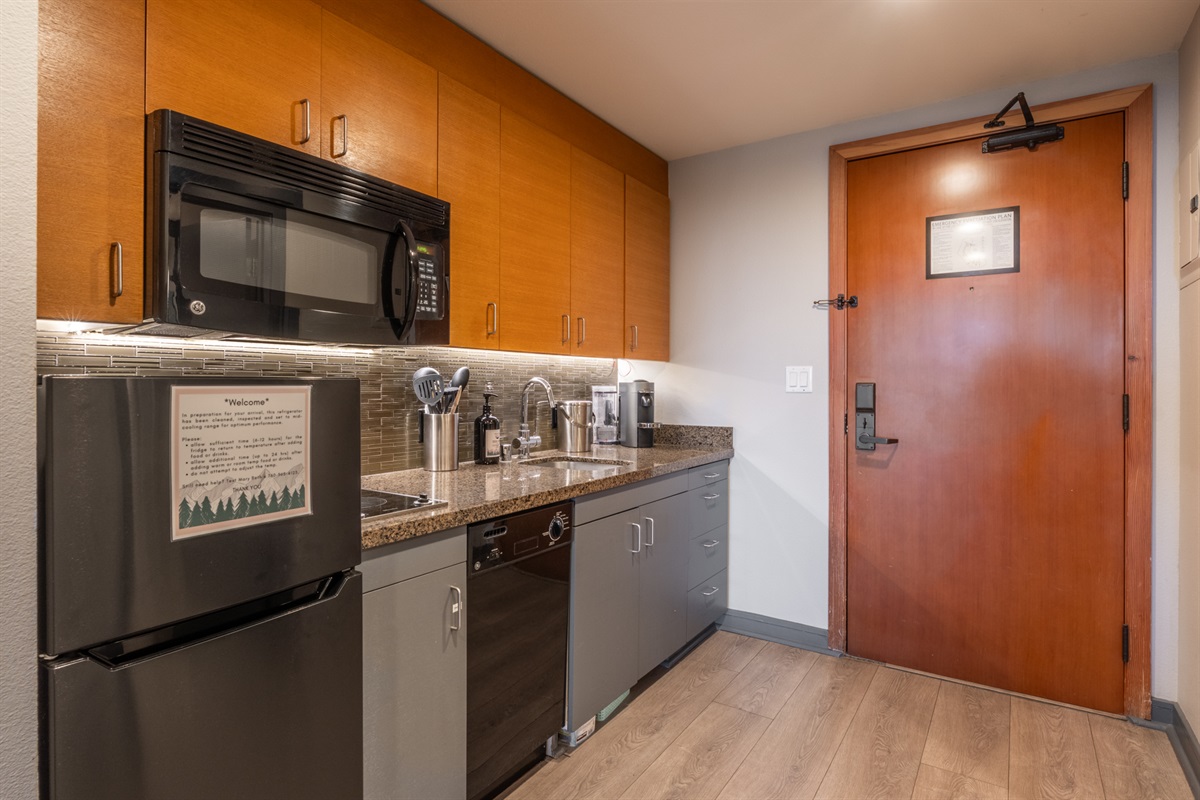 The galley kitchen sits just inside the entry, making it easy to drop groceries and settle in the moment you arrive.