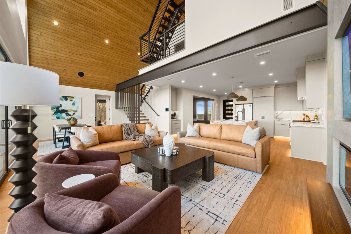 A spacious view of the main living area that&rsquo;s designed for comfort, with room to lounge, watch a show, and still enjoy the beautiful modern style.