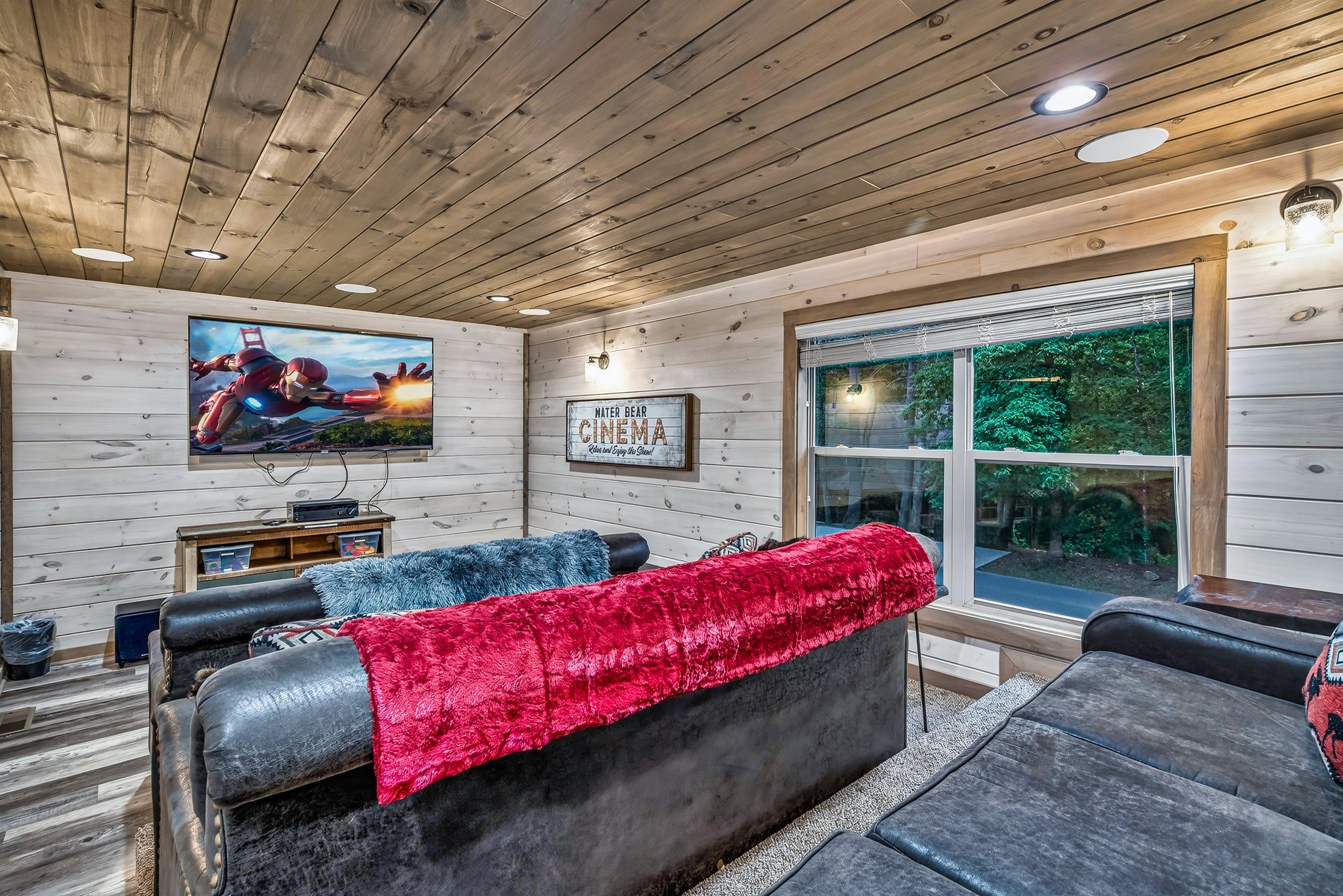 Family-friendly theater room with 75 inch Roku 