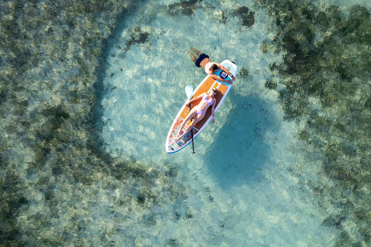 Watersports Galore: Start the day on a Crystal Kayak or paddleboard, or charter a boat to snorkel and feed sea turtles at Green Turtle Cay.