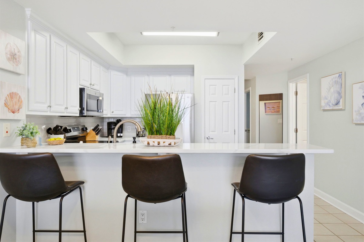 Whether you're serving breakfast before a beach day or enjoying takeout after sunset, this gathering space is ready for it all.