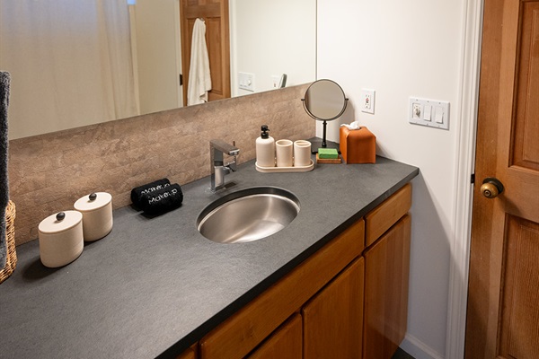 Clean and well maintained bathroom with fresh towels and essential amenities