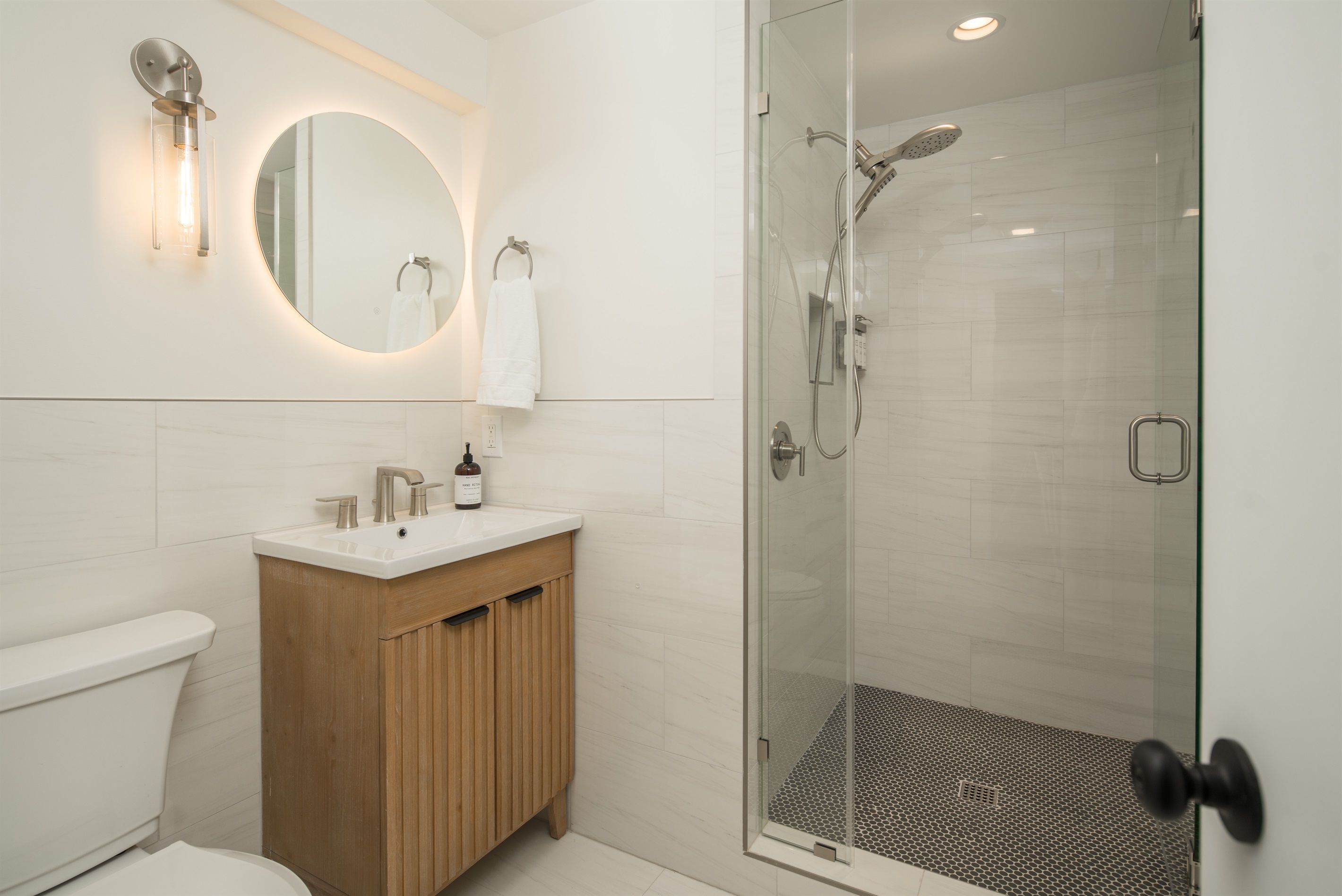 Bathroom #2: Located near the Summer Kites Bedroom, you'll find heated floors, a lighted mirror, hair dryer, and hair and body wash products.